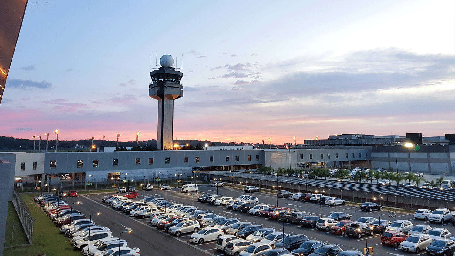 Airport parking lot at dusk